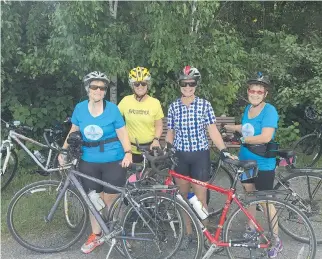  ??  ?? Kristin Goff, left, Lynn Campbell, Arlene Steadman and Louise Rachlis all enjoy cycling and this photo was taken during their annual Antiques of Steel triathlon. Rachlis urges everyone on the road to show each other respect.