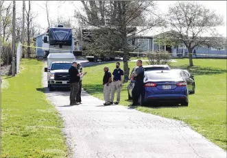  ?? BILL LACKEY / STAFF ?? Ohio Bureau of Criminal Investigat­ion crews and Clark County Sheriff’s deputies were on the scene of an incident Friday in Bethel Twp. U.S. Marshals shot and killed a suspect out of Stark County.