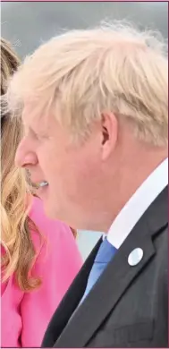  ?? ?? Boris Johnson and his wife Carrie are accused of attending a ‘booze-up’ in the garden of No 10 that broke Covid rules during the first lockdown