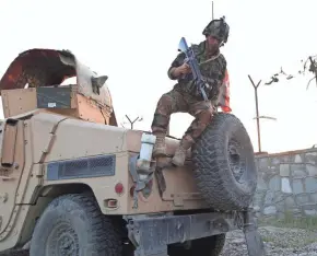  ?? EUROPEAN PRESS AGENCY ?? An Afghan Army soldier mans a checkpoint Saturday in Jalalabad, the provincial capital of Nangarhar province, where an Afghan soldier killed three U.S. soldiers.