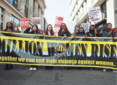  ?? ALISHIA ABODUNDE/GETTY IMAGES ?? Marchers take part in the Million Women Rise annual march on March 9 in London, England.