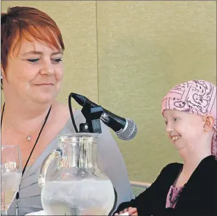  ?? THE ASSOCIATED PRESS ?? Hayley Okines (right) talks during an interview with her mother, Kerry. Hayley was a campaigner who raised awareness of the rare genetic condition progeria, which causes those affected to age eight times faster than average.