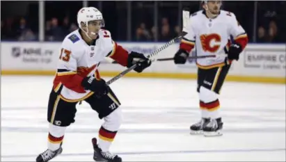  ?? ADAM HUNGER — THE ASSOCIATED PRESS ?? Calgary Flames left wing Johnny Gaudreau (13) in action against the Rangers in the third period. The Flames won 4-1.