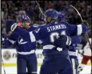  ?? Chris O’Meara The Associated Press ?? Tampa Bay Lightning center Steven Stamkos (91) celebrates his goal against the Columbus Blue Jackets with teammates during the second period on Saturday in Tampa, Fla.