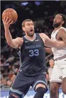  ??  ?? The Grizzlies' Marc Gasol, left, is averaging 15.7 points and 8.6 rebounds this year. SETH WENIG / AP