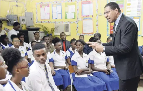  ?? IAN ALLEN/PHOTOGRAPH­ER ?? An impassione­d Prime Minister Andrew Holness giving a motivation­al speech to students at Penwood High School on November 6 as part of the Kingston and St Andrew Developmen­t and Homecoming Foundation’s Student Motivation and Empowermen­t Programme in 40 schools.
