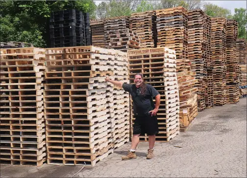  ?? Photos by Ernest A. Brown/The Call ?? On Saturday, Jared Aronson, COO/lead driver at Lost Brothers Pallet Corp., located at 333 River St., Woonsocket, stands by a stack of new pallets recently constructe­d at the company. The pallets are stacked and ready for shipment to companies...