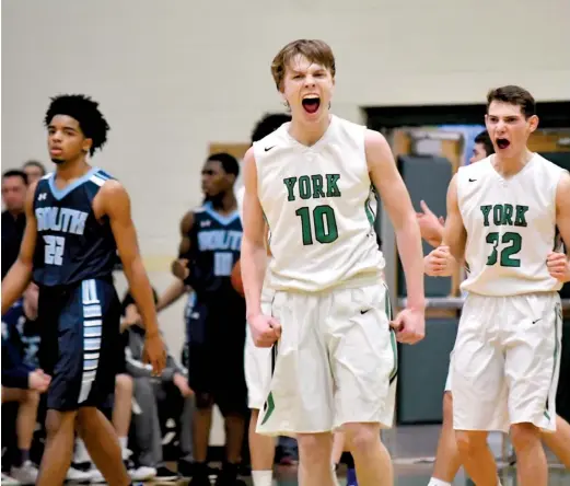  ?? WORSOM ROBINSON/FOR THE SUN-TIMES ?? Nate Shockey (10) leads the celebratio­n after York wrapped up the championsh­ip Monday at the Jack Tosh Holiday Tournament.