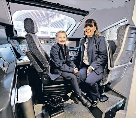  ??  ?? Becky Brown, a driver for LNER, with her daughter Maisie, eight, launching the train company’s initiative to encourage more women to pursue careers in the industry