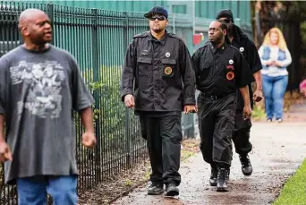  ?? Brett Coomer/Staff file photo ?? Vincent Dickson, left, James Jones, Yahcanon Ben Yah and Maitreya Ahsekh prepare to hold a news conference distancing the People’s New Black Panther Party from activist Quanell X in 2018.