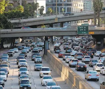  ?? Gary Coronado Los Angeles Times ?? THE 110 FREEWAY in downtown Los Angeles, where the air has benefited from California’s strict standards. The state’s goal is to have over 1 million zero-emission vehicles and plug-in hybrids on its roads by 2025.
