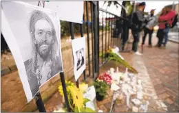  ?? FERNANDO VERGARA AP ?? An image of Taylor Hawkins adorns a makeshift memorial in Colombia Saturday.