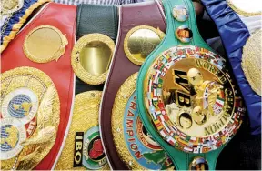  ?? Photo: CHRISTIAN CHARISIUS/AFP VIA GETTY IMAGES ?? SHINY BELTS: But so many of them is unnecessar­y