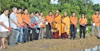  ??  ?? Sibu Namo Buddha Buddhist Society chairman Kapitan Liew Kwan Hua (sixth right), Khenpo Dawa Rinpoche (fifth right) from Nepal and others perform the ground-breaking ceremony for the constructi­on of the society’s new building at Tun Ahmad Zaidi Adruce Road in Sibu. The project to construct the two-storey block on a one-acre land costs RM8 million. The society is appealing to the public for donations to enable the project to be carried out successful­ly.