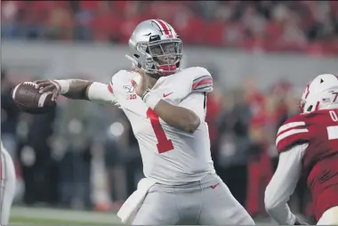  ?? NATI HARNIK — THE ASSOCIATED PRESS ?? Ohio State quarterbac­k Justin Fields passes against Nebraska during a 2019game.