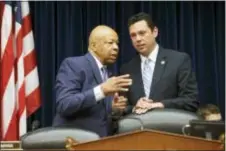  ?? J. SCOTT APPLEWHITE — THE ASSOCIATED PRESS FILE ?? House Oversight and Government Reform Committee Chairman Rep. Jason Chaffetz, R-Utah, right, confers with the committee’s ranking member Rep. Elijah Cummings, D-Md. on Capitol Hill in Washington. Donald Trump’s status as a Washington outsider fuels his fiery populism and also is helping to shield him from the scrutiny House Republican­s are devoting to Hillary Clinton, a former U.S. senator and secretary of state.