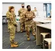  ?? U.S. AIR FORCE PHOTO BY WESLEY FARNSWORTH ?? Chief Master Sergeant of the Air Force JoAnne S. Bass talks with Airmen assigned to the Air Force Life Cycle Management Center during her visit to AFLCMC Simulation building in June 2021.