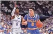  ?? MARK ZEROF, USA TODAY SPORTS ?? De’Aaron Fox, left, and Lonzo Ball split a pair of games as college players last season.