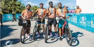  ?? COURTESY ?? Dolphins players Myles Gaskin, Jevon Holland, Cedrick Wilson Jr. and Salvon Ahmed participat­e in the team’s 13th annual Dolphins Challenge Cancer event at Hard Rock Stadium on Saturday.