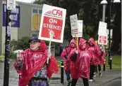  ?? ERIC RISBERG / AP ?? Susan Englander (left) warns people not to cross a picket line at San Francisco State University, on Monday. Nearly 30,000 workers at California State University’s 23 campuses walked off the job.