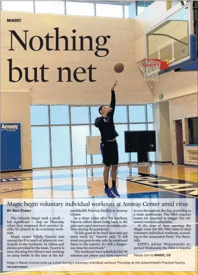  ?? ORLANDO MAGIC ?? Magic’s Nikola Vucevic puts up a shot during a voluntary individual workout Thursday at the AdventHeal­th Practice Facility.