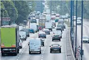  ??  ?? Traffic builds in London, where there will be new timetables for public transport, left. Children, right, have been allowed outdoors in parts of Europe