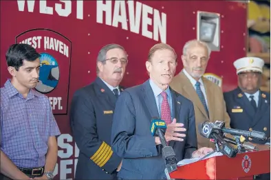  ?? PATRICK RAYCRAFT/HARTFORD COURANT PHOTOS ?? Sen. Richard Blumenthal, D-Conn., center, speaks at a news conference Monday at the West Haven Fire Department to call for the passage of legislatio­n that would make permanent the September 11 Victim Compensati­on Fund. Behind Blumenthal is, from left, state Rep. Michael DiMassa, D-West Haven; West Haven Fire Chief James O’Brien; Lou Esposito, chief of staff for the West Haven mayor; and New Haven Fire Chief John Alson.