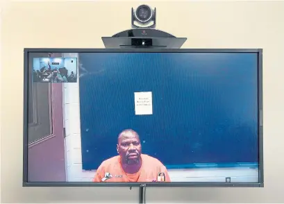  ?? ANDREW FRANCIS WALLACE/TORONTO STAR ?? Ebrahim Toure, Canada's longest serving immigratio­n detainee still in detention, is seen on a video feed from a maximum-security jail, during a break in his monthly immigratio­n detention review hearing in Rexdale last June.