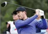  ?? TOM REEL — THE SAN ANTONIO EXPRESS-NEWS VIA AP ?? Kevin Chappell hits into the wind on the 9th tee during the third round of the Valero Texas Open at TPC San Antonio Oaks Course in San Antonio, Texas, Saturday.