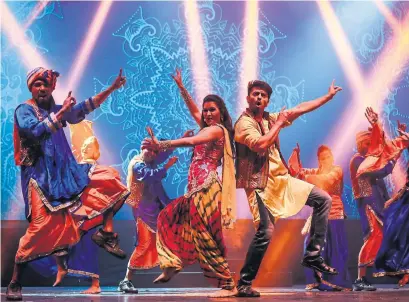  ??  ?? The stunning song and dance numbers performed by the 26-member cast of “Taj Express” truly make the show, Carly Maga writes.