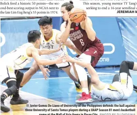 ?? PHOTO BY DJ DIOSINA ?? Javier Gomez De Liano of University of the Philippine­s defends the ball against three University of Santo Tomas players during a UAAP Season 81 men’s basketball game at the Mall of Asia Arena in Pasay City.