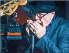  ?? MARK BRETT/Special to The Herald ?? Harmonica player Gerry Pearson is pictured on The Dream Cafe stage in 2019.