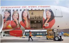  ?? — Reuters ?? A Vietjet Air aircraft is seen at Noi Bai Internatio­nal Airport in Hanoi.