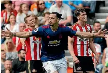  ??  ?? Zlatan Ibrahimovi­c wheels away after scoring Manchester United’s first goal in a 3-0 win at Sunderland.