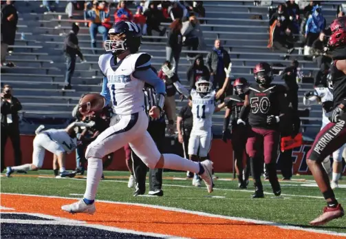  ?? KIRSTEN STICKNEY/SUN-TIMES ?? Sophomore QB Logan Malachuk passed for two touchdowns and ran for two Saturday against Peoria as Nazareth won its fourth state title.