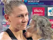  ??  ?? Taste of success: Casey Kopua is licked by her daughter, Maia, after New Zealand’s win in the Netball World Cup