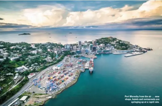  ??  ?? Port Moresby from the air … new shops, hotels and restaurant­s are springing up at a rapid rate.