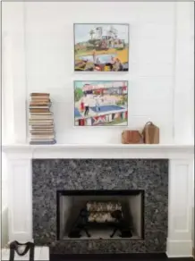  ?? By Melissa Rayworth
Associated Press
MAX HUMPHREY/BURNHAM DESIGN VIA AP ?? Two simple, handmade wooden sculptures add a casual charm to this fireplace designed by Burnham Design of Los Angeles.