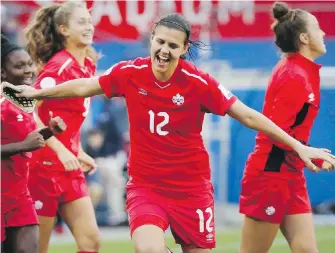  ??  ?? Canada forward Christine Sinclair celebrates at the conclusion of their match against Panama at the CONCACAF qualifying tournament in Frisco, Texas, on Sunday.