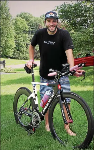  ?? CHRIS BARBER — DIGITAL FIRST MEDIA ?? Ian Harding trains for the upcoming national triathlon championsh­ip on his bike as well as in the pool and on the road.