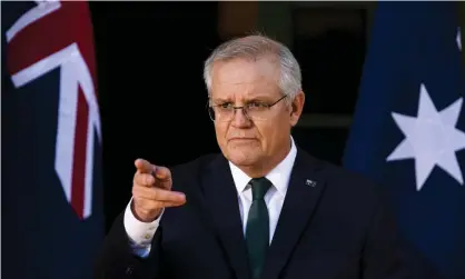  ?? Photograph: Lukas Coch/AAP ?? Scott Morrison speaks to the media in Canberra on Wednesday. The Australian prime minister said he had been pressing the technical advisory group on immunisati­on to change its recommenda­tion on the AstraZenec­a vaccine.