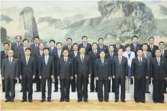  ??  ?? 0 Chinese president Xi Jinping poses with North Korean officials in Beijing. China has urged the North not to cancel the US summit