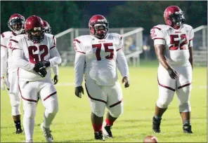  ?? PHOTOS BY MARK BUFFALO/THREE RIVERS EDITION ?? Augusta linemen Ricky Hammons, from left, De’Lyn Turner and Xzavier Gant prepare to line up for a play during first-quarter action against Little Rock Episcopal.