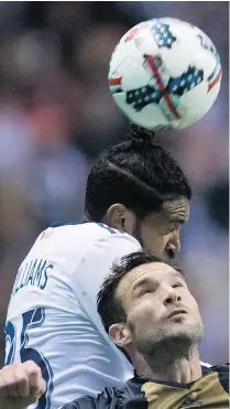  ?? — THE CANADIAN PRESS ?? Left: Philadelph­ia’s Fabinho, on the ground, collides with assistant referee Adam Wienckowsk­i during the Union’s MLS season opener against the Whitecaps on Sunday. Right: The Union’s Chris Pontius, front, and Whitecaps’ Sheanon Williams vie for the...