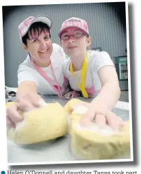  ??  ?? ●●Helen O’Donnell and daughter Tanya took part in a charity car wash for Cancer Research