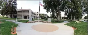  ?? RECORDER PHOTO BY CHIEKO HARA ?? The American flag rises Thursday, May 17 at Veterans Memorial at Portervill­e College. The flags were lowered when the college observed National Peace Officers’ Memorial Day. The dedication of the memorial will be held next week.