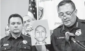  ?? Jay R. Jordan / Houston Chronicle ?? Police Chief Art Acevedo holds a photo of Jose Gilberto Rodriguez, 46, during a news conference Monday. Rodriguez is a suspect in a weeklong crime spree, mostly on the northwest side of town.