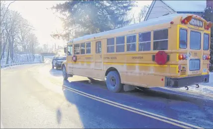  ?? Provided by Albany County Sheriff’s Office ?? This Voorheesvi­lle school bus was damaged when it was hit from behind by a minivan in 2018. The Legislatur­e wants to allow cameras to capture license plate numbers of vehicles that illegally go around school buses.