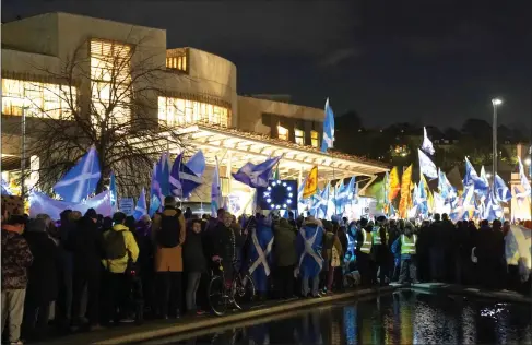  ?? ?? Pro-independen­ce supporters gather outside the Scottish Parliament on Wednesday after the Supreme Court delivered its verdict on the Scottish Government’s Indyref2 proposal