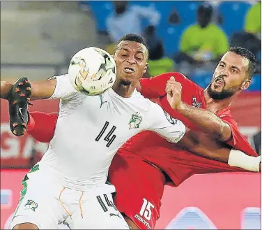  ?? Picture: AFP ?? FIGHTING FOR IT: Togo’s midfielder Alaixys Romao, right, challenges Ivory Coast’s forward Jonathan Kodjia during their Africa Cup of Nations match in Oyem yesterday